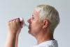 Woman drinking out of Ornamin Spouted Small Opening Drinking Lid